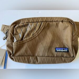 PATAGONIA STAND UP BELT BAG. WATER RESISTANT ORGANIC COTTON. BROWN. NEW W/  TAGS